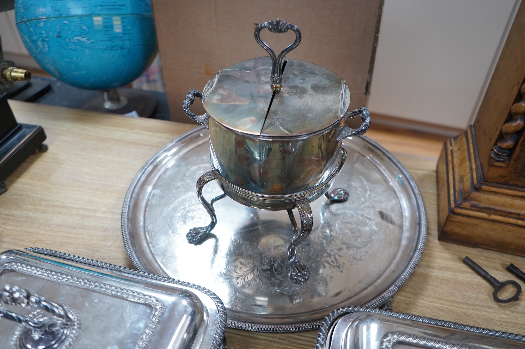 A pair of silver plated entrée dishes, an egg coddler and salver